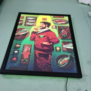 LED snap frame with colorful fish art and a man in a stylish outfit against a vibrant green background.
